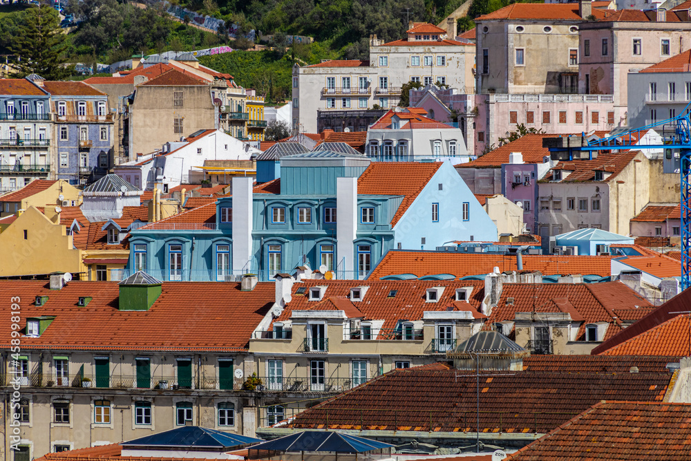 Building facades in the center of Lisbon fill the urban scene with historic and traditional architecture.