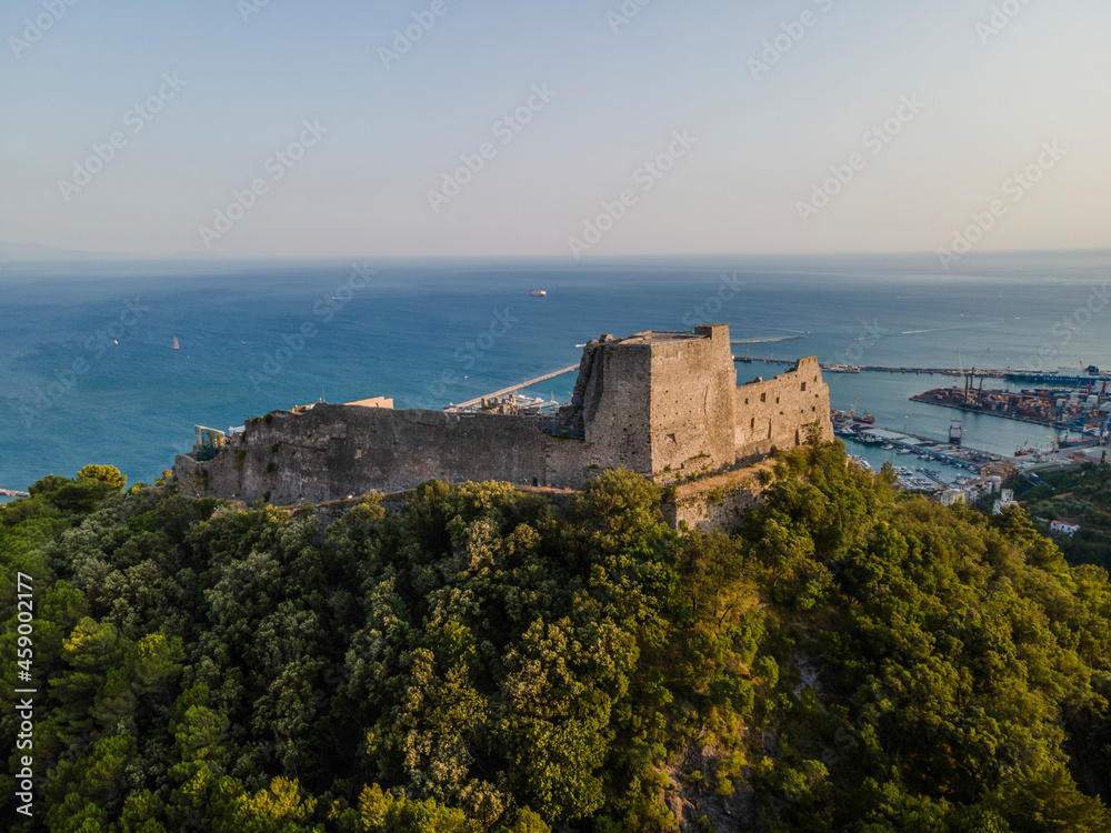 Aerial view of Arechi castle on hilltop with Mediterranean Sea in background during sunset, Salerno, Italy. Aerial view of Arechi castle on hilltop with Mediterranean Sea in background during sunset, Salerno, Italy.