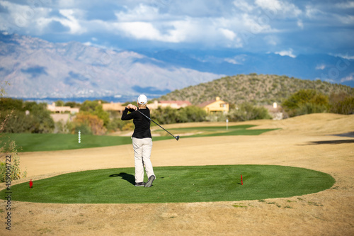 Retired Woman playing Golf in Tucson Arizona 