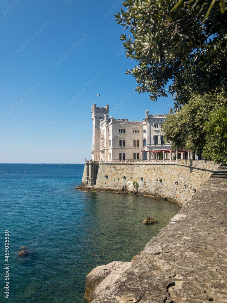 Entrance to the historical museum and park of Miramare castle, Trieste, Friuli-Venezia Giulia. 09-05-2021. People strolling in the open air by the sea. Italy
