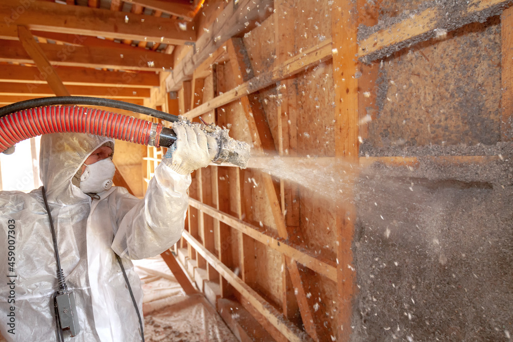 Spraying cellulose insulation on the wall. Wet way - obrazy, fototapety, plakaty 