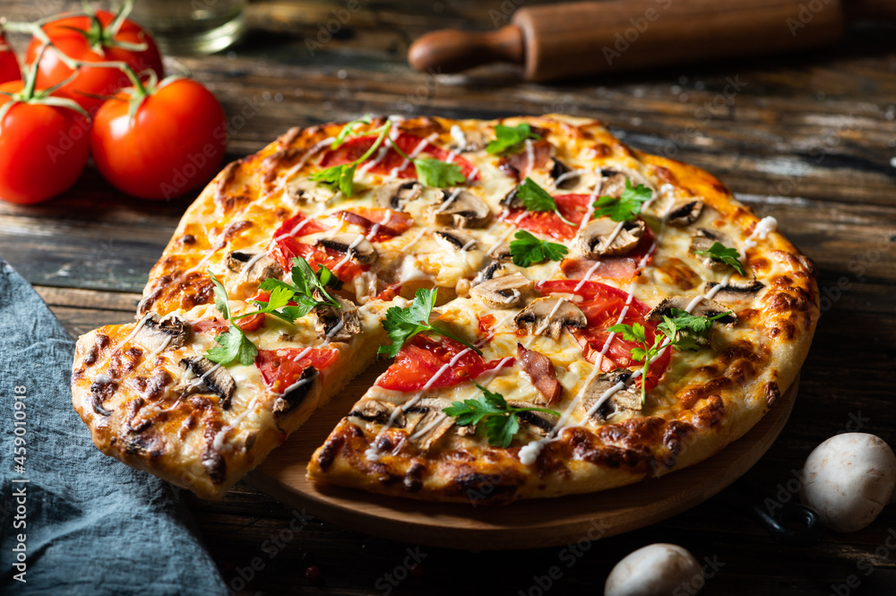 tasty juicy pizza on wooden background. lots of meat and cheese. Mushroom pizza. Pepperoni pizza. Mozzarella and tomato. Italian dish. Italian food. Comfort food. Local food