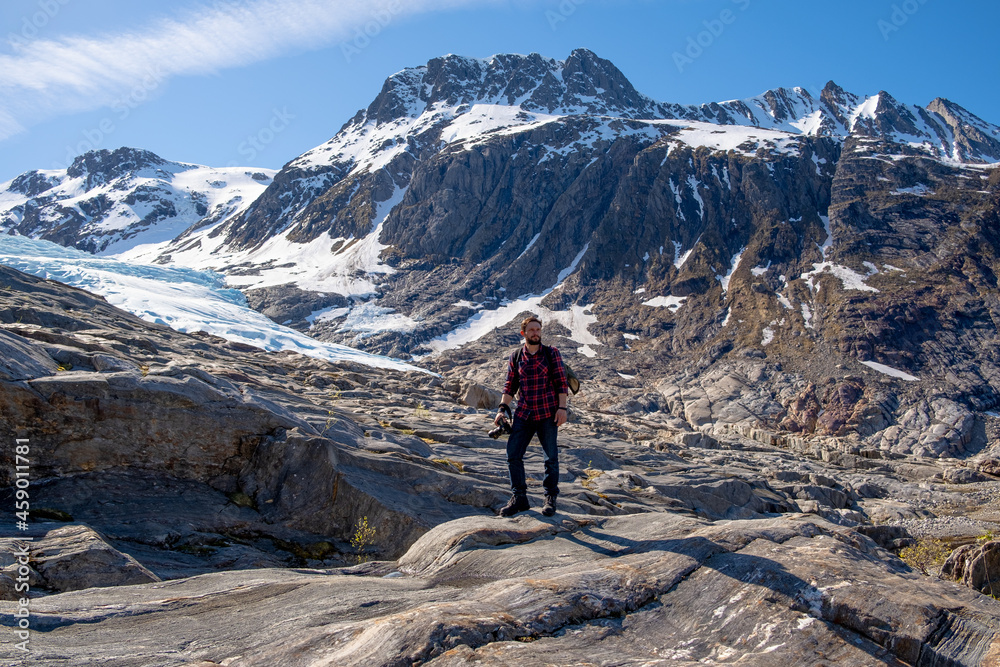 Man tourist with standing of great mountain Scandinavia nature