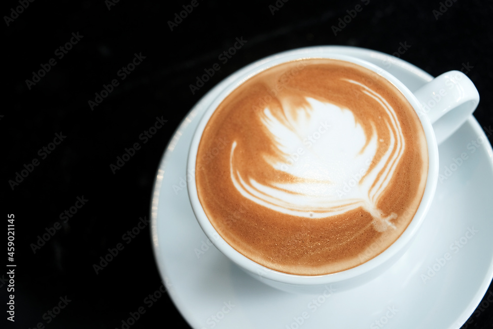 Cup of Latte coffee on black background Cup of Latte coffee on black background