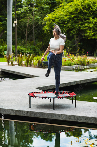 young latin woman exercising in a botanical park in sinaloa