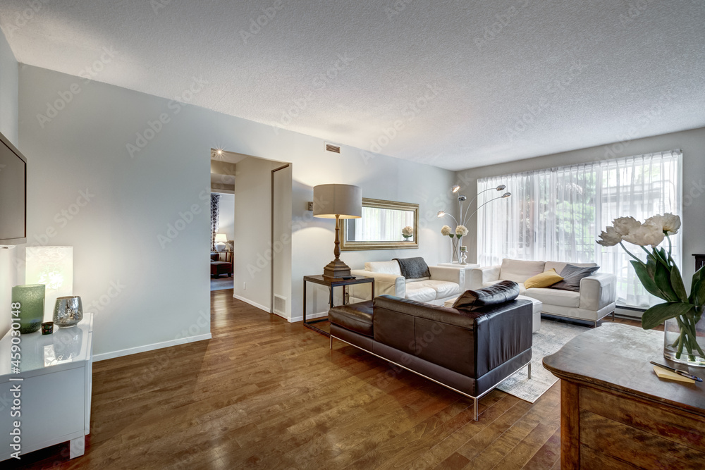 Fototapeta premium Beautiful renovated and staged with nice furniture condominium in Montreal, Westmount, Canada