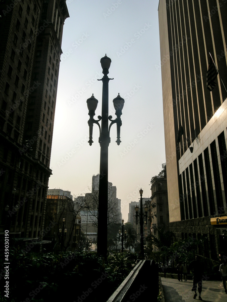 Fototapeta premium Old pole and Martinelli Building, seen from Sao Joao Avenue, downtown São Paulo