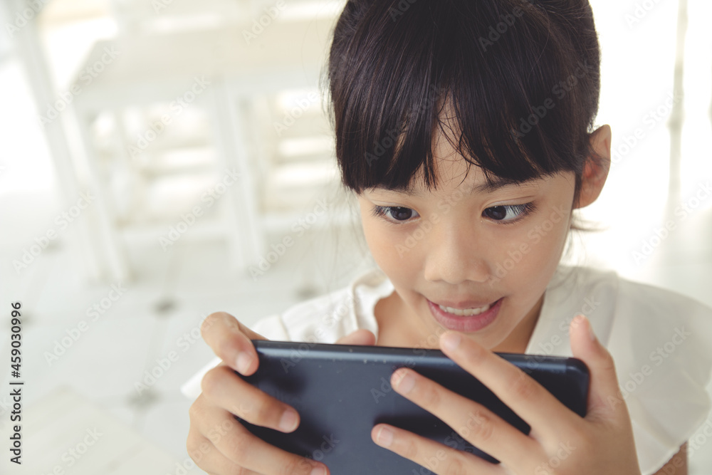 Little girl using smartphone, Social media concept. Little girl using smartphone, Social media concept.