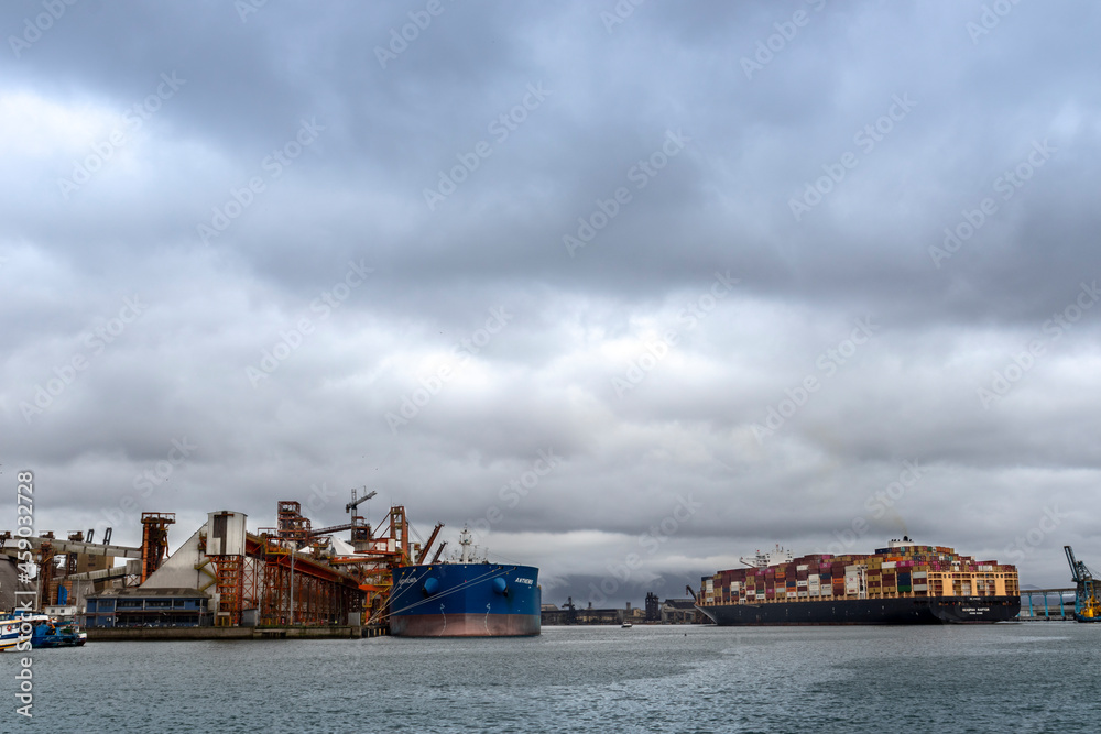 Santos, Sao Paulo, Brazil, September 17, 2021. Cargo ship from Hong Kong loaded with containers is towed through the channel of the Port of Santos, coast of Sao Paulo state, Brazil