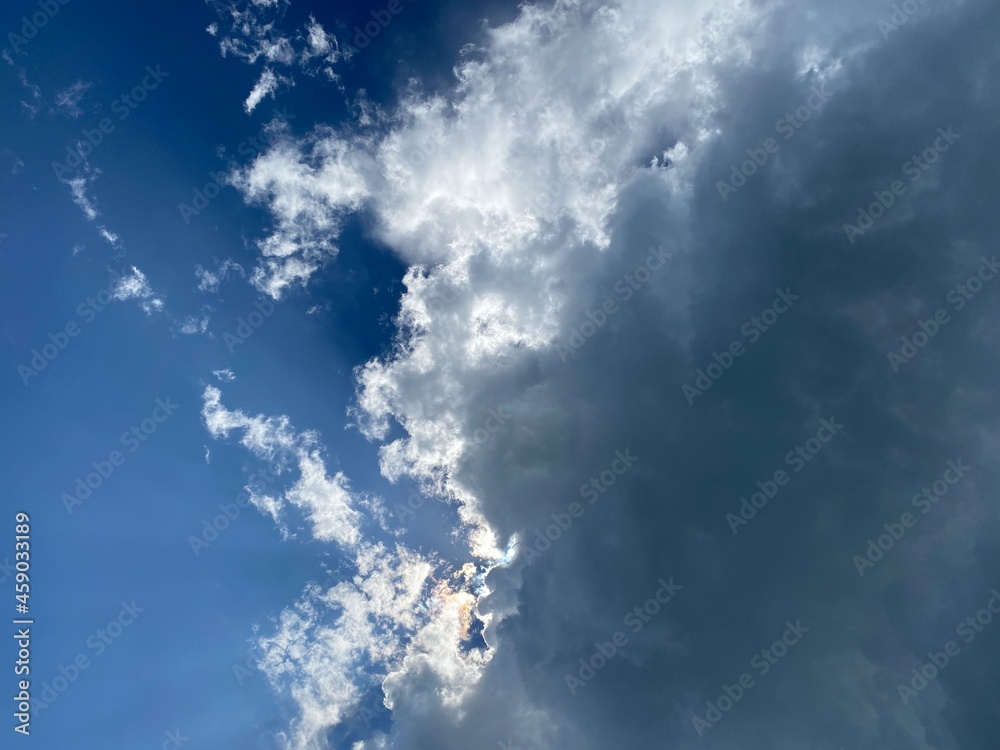 Sunburst visible from behind a dark cloud. Sunburst visible from behind a dark cloud.