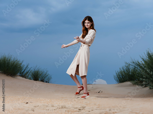 woman in coat sand summer lifestyle fashion