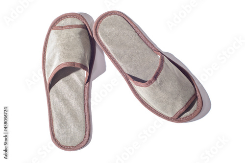 Gray one-off slippers for hotel on a white background