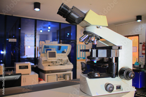 microscope with metal lens and cobas at laboratory