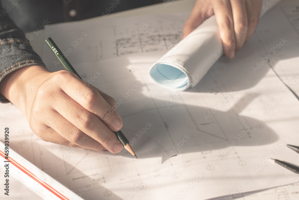 Architect working on blueprint. Architects workplace - architectural ...