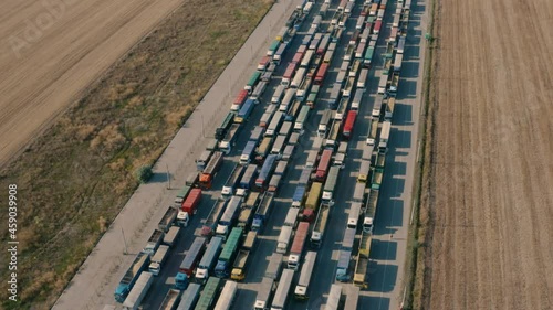 Trucks in line at the loading terminal. Transportation of goods by cars.