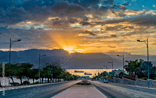 Morning landscape with street leading to the Red Sea during sunrise above mou...