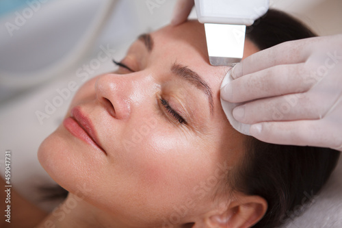 Mature womn getting facial skincare treatment