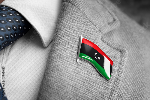 Metal badge with the flag of Libya on a suit lapel