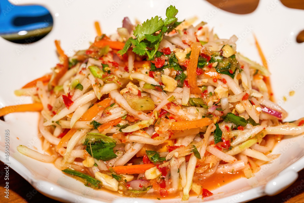 A delicious Thai hot and sour green papaya salad A delicious Thai hot and sour green papaya salad
