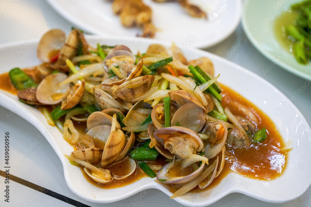 A dish of delicious fragrant fried flower conch seafood A dish of delicious fragrant fried flower conch seafood