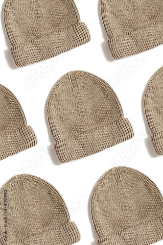 Pattern with beige knit hat isolated on white. Fashion handmade cap for winter and autumn