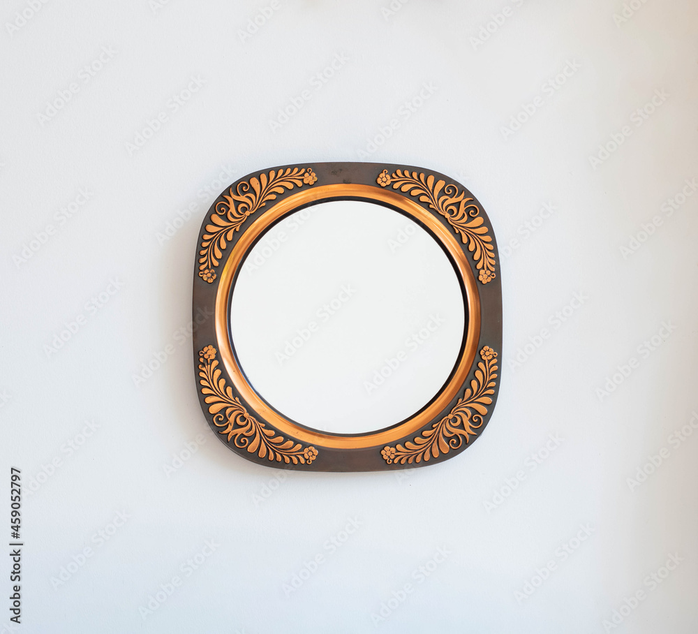 Mid-century modern copper wall plate, mirror - isolated on white wall Mid-century modern copper wall plate, mirror - isolated on white wall