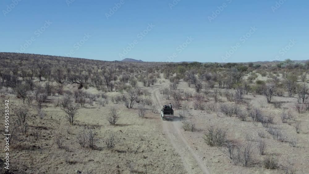 Aerial View African Safari Truck Driving Through Game Reserve, Namibia Aerial View African Safari Truck Driving Through Game Reserve, Namibia