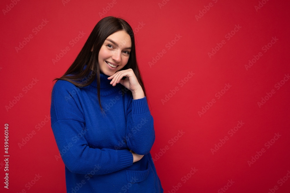 Photo of attractive cute happy emotional young woman poising isolated on background wall with free space wearing trendy casual clothes Photo of attractive cute happy emotional young woman poising isolated on background wall with free space wearing trendy casual clothes