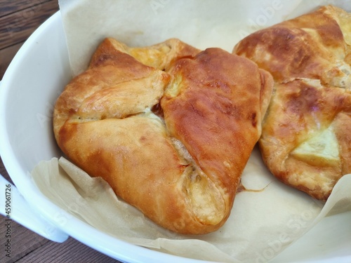 Baked puff pastry buns with cheese khachapuri