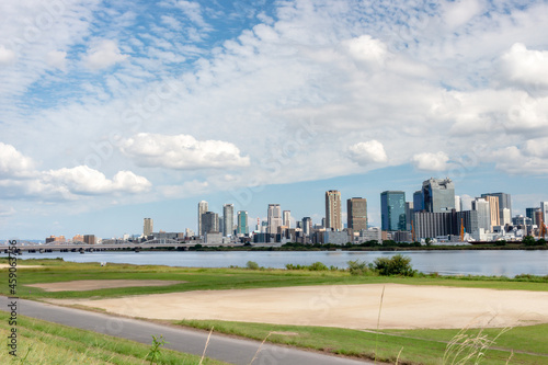 View of office buildings of central Osaka city from Yodogawa river bank