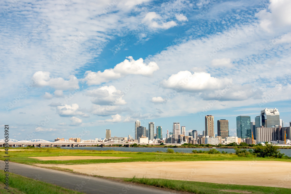 View of office buildings of central Osaka city from Yodogawa river bank View of office buildings of central Osaka city from Yodogawa river bank