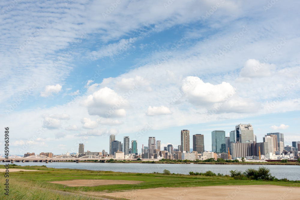 View of office buildings of central Osaka city from Yodogawa river bank