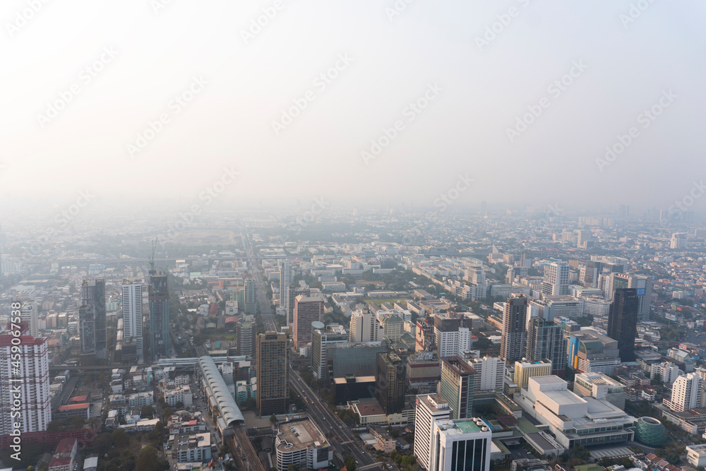 Landscape of the top view Bangkok metropolis Thailand with the dirty clouds air pollution problem. the tower and building in business area