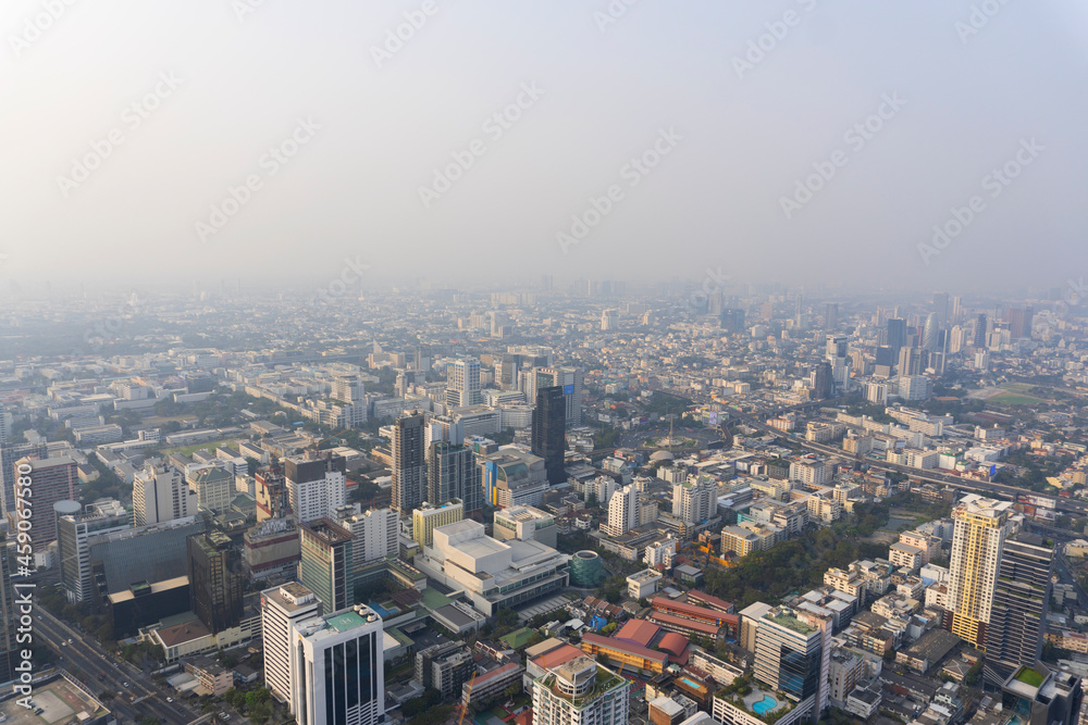 Landscape of the top view Bangkok metropolis Thailand with the dirty clouds air pollution problem. the tower and building in business centre area