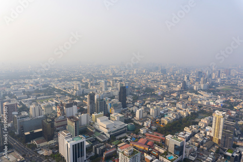 Landscape of the top view Bangkok metropolis Thailand with the dirty clouds air pollution problem. the tower and building in business centre area