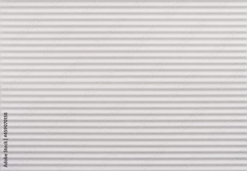 White ceramic tile with corrugated design. For using as background and texture.