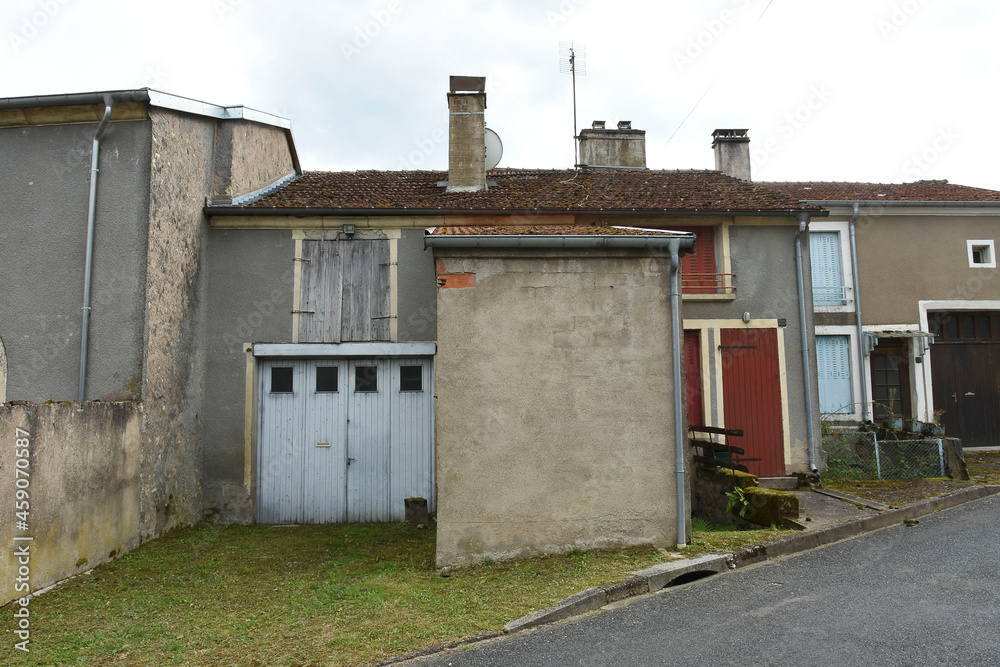 facades of old, closed houses and barns in the old village of Voisey in Champagne Ardennes in France