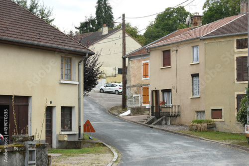 street with old houses and barns in the little village of Voisey in the French region Champagne Ardennes