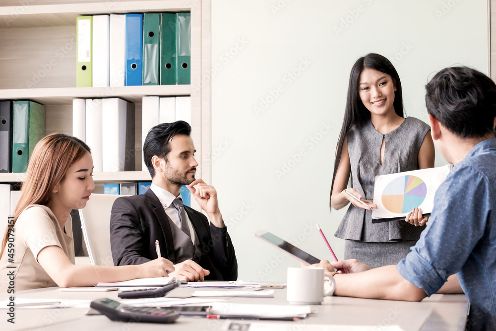 Business woman and team having meeting at meeting room in office. Business woman and team having meeting at meeting room in office.