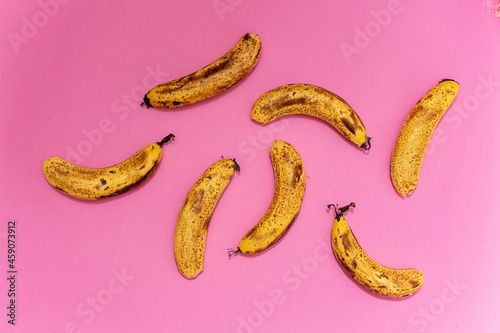 8 ripe bananas on a pink background, homage to the Velvet Underground album or just to a very tasty banana