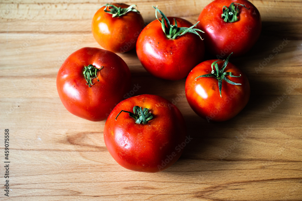 Organic tomatoes on wooden table from Anatolian region, Turkey Organic tomatoes on wooden table from Anatolian region, Turkey