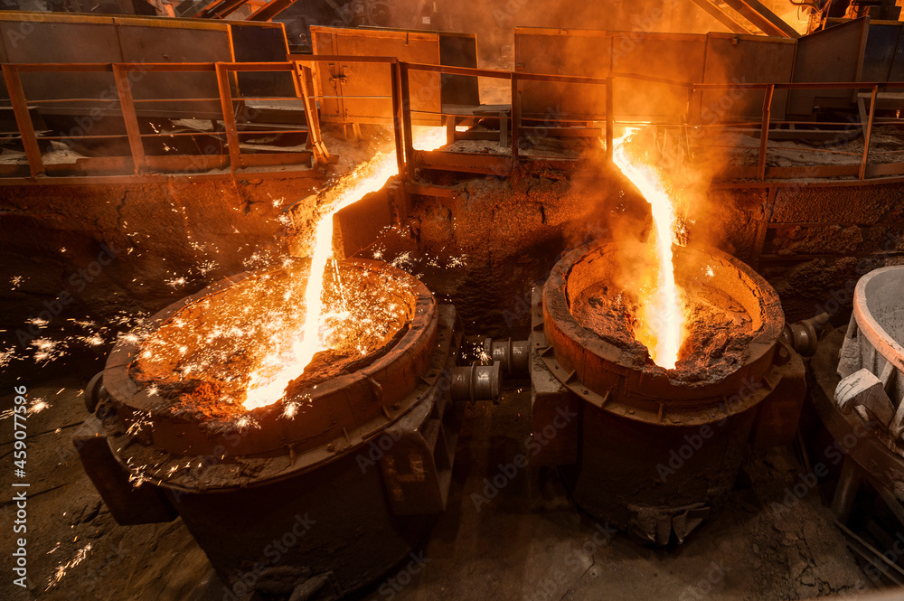 Blast furnace slag tapping. The molten slag is poured into a ladle