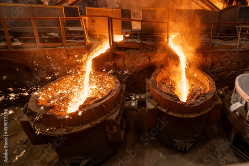 Blast furnace slag tapping. The molten slag is poured into a ladle. photo