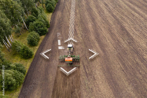 Autonomous tractor on the field. Digital transformation in agriculture photo