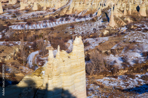 . Fairy tale chimneys in Cappadocia with blue sky on background. Love Valley in Cappadocia