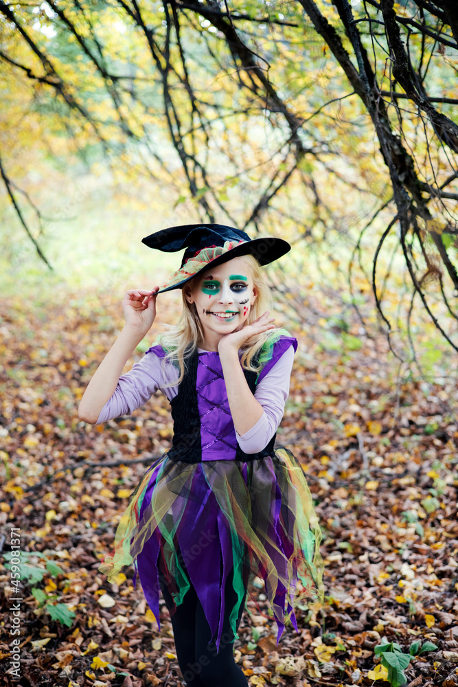 Portrait of a girl in a witch costume for Halloween Portrait of a girl in a witch costume for Halloween