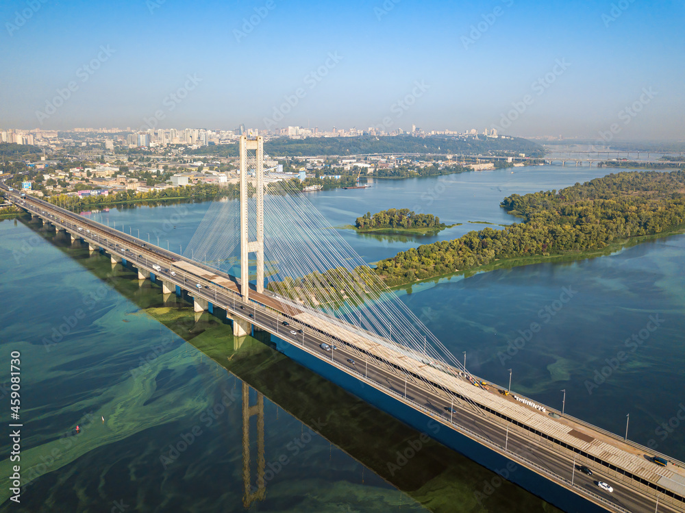 South bridge in Kiev. Algae bloom in the water of the Dnieper River. Aerial drone view.