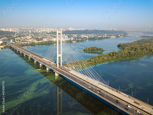 South bridge in Kiev. Algae bloom in the water of the Dnieper River. Aerial drone view.