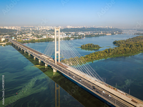 South bridge in Kiev. Algae bloom in the water of the Dnieper River. Aerial drone view.