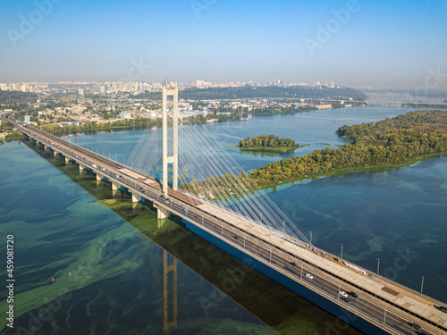 South bridge in Kiev. Algae bloom in the water of the Dnieper River. Aerial drone view.